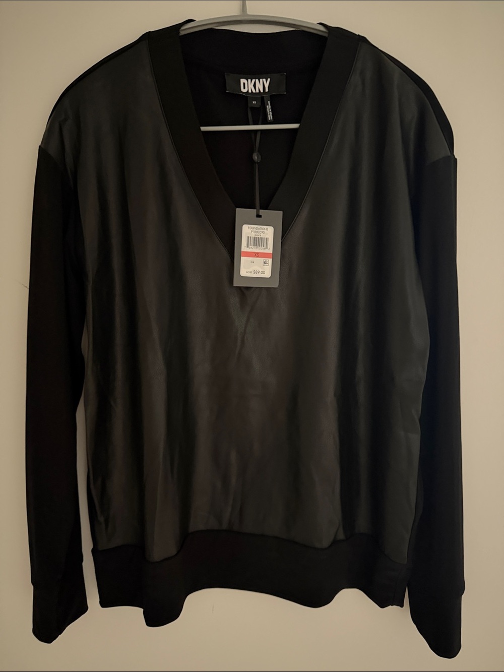 DKNY Beautiful black sweater with black leather front ,new with tag
